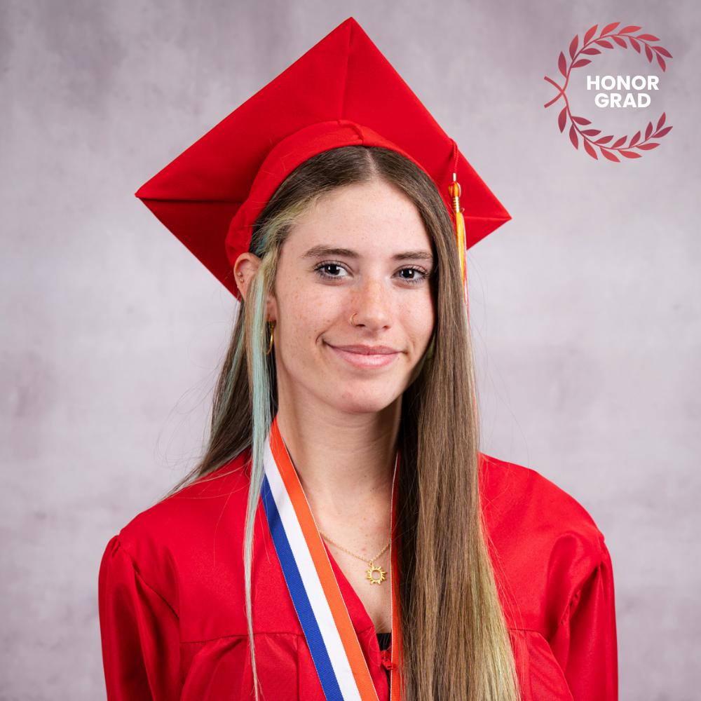 Priscilla LeFors wearing a red cap and gown.