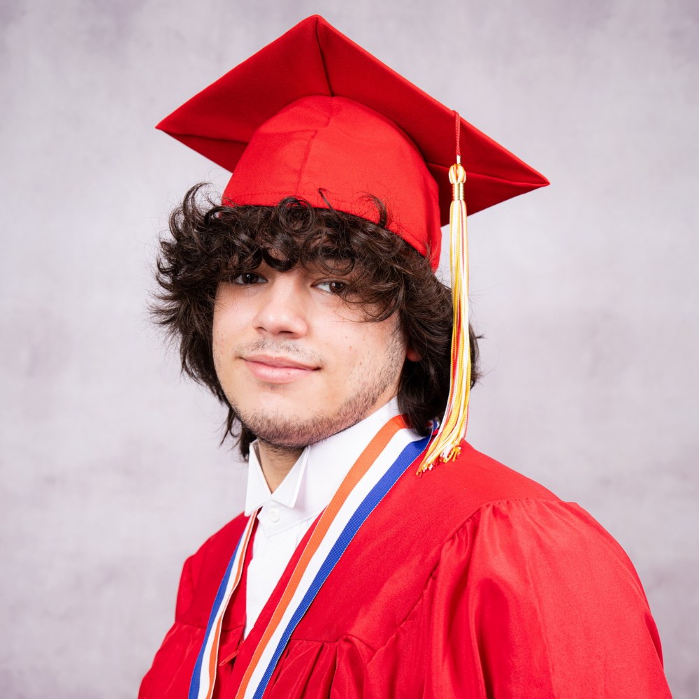 Nathaniel Loomis wearing a red cap and gown.