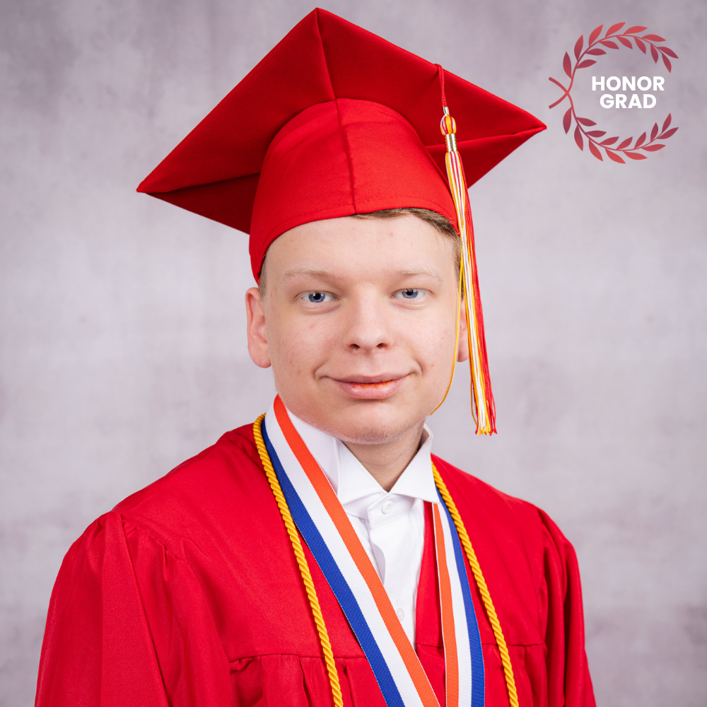Dakota Spidle wearing a red cap and gown.