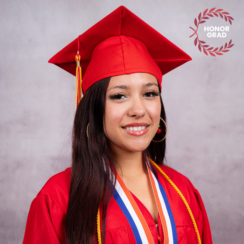 Daniela Torres wearing a red cap and gown.