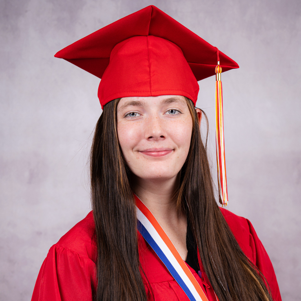 Cierra Williamson wearing a red cap and gown.