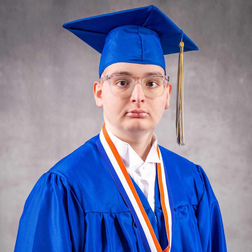 Eligio Alvarez-Lopez wearing a blue cap and gown.