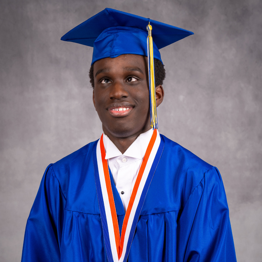 Jayden Fleurimond wearing a blue cap and gown.
