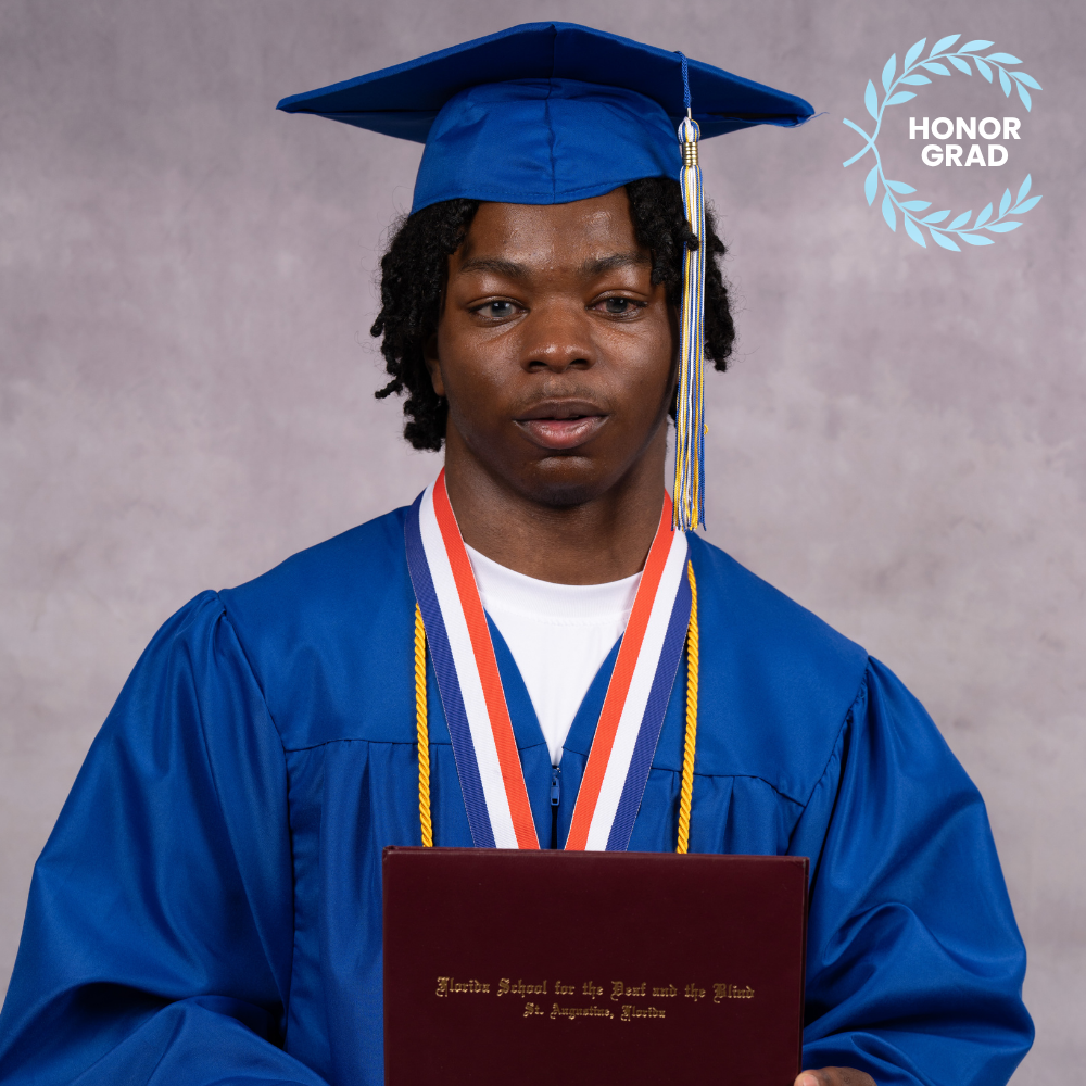 Khayree Lofton wearing a blue cap and gown.