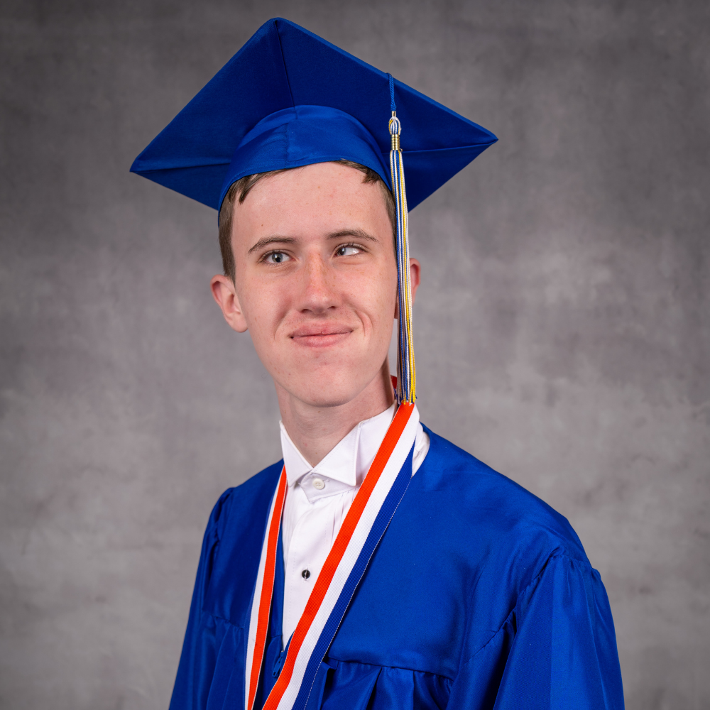 Mason Long wearing a blue cap and gown.