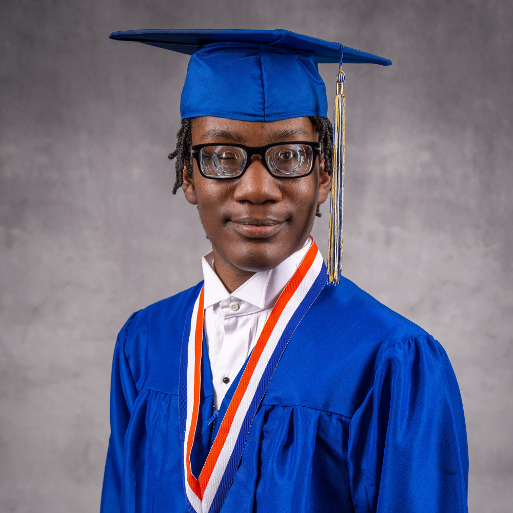 Jeremiah Matthews wearing a blue cap and gown.