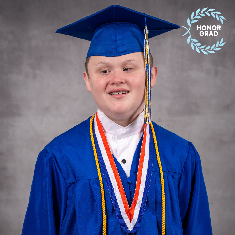Logan Strickland wearing a blue cap and gown.