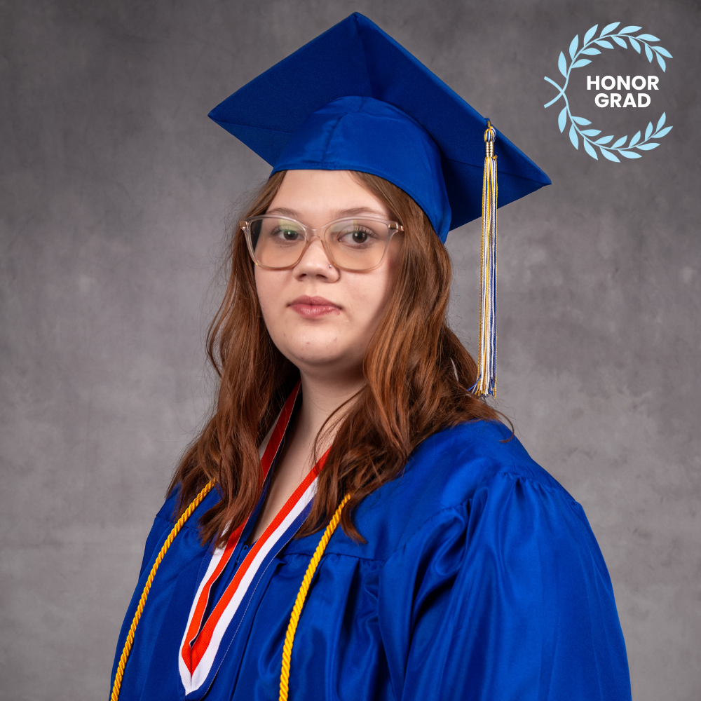 Brooke Witherington  wearing a blue cap and gown.