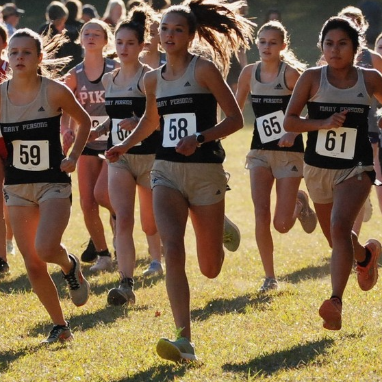 female cross country runners competing in race