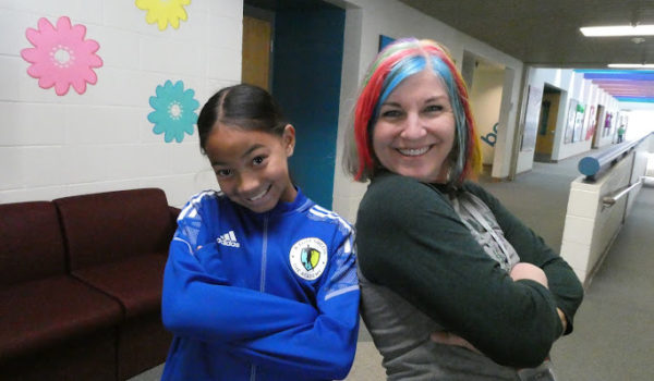 kids dresses up smiling to camera