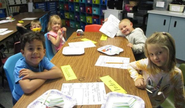 kids sitting looking at camera