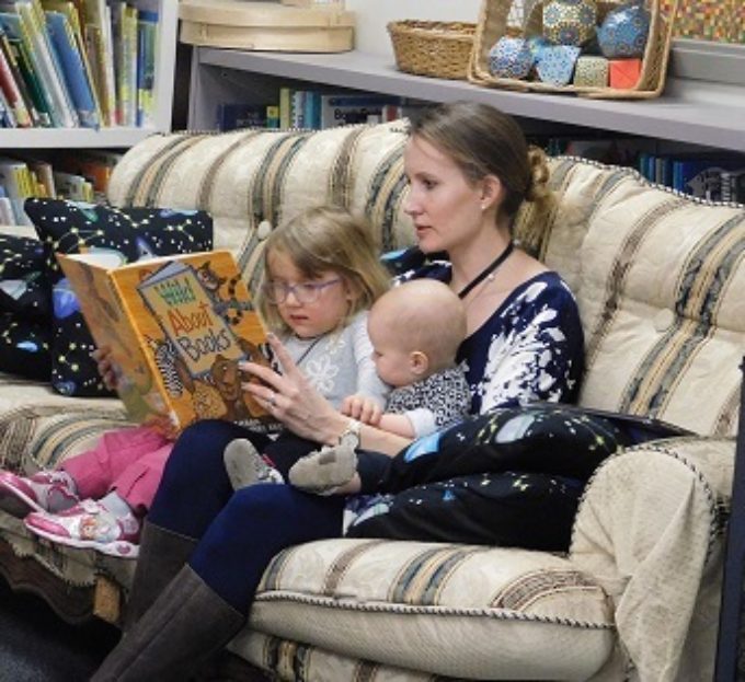 Mom reading to kids