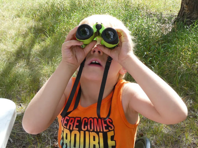 kid with binoculars