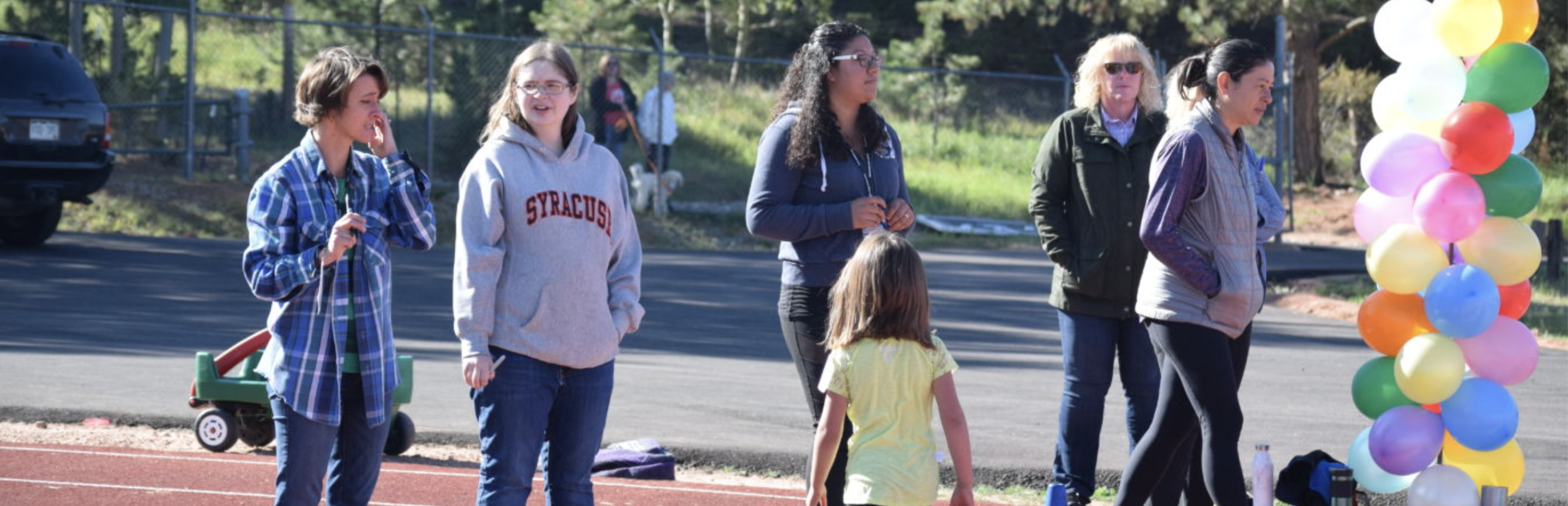 school parents standing on the track 