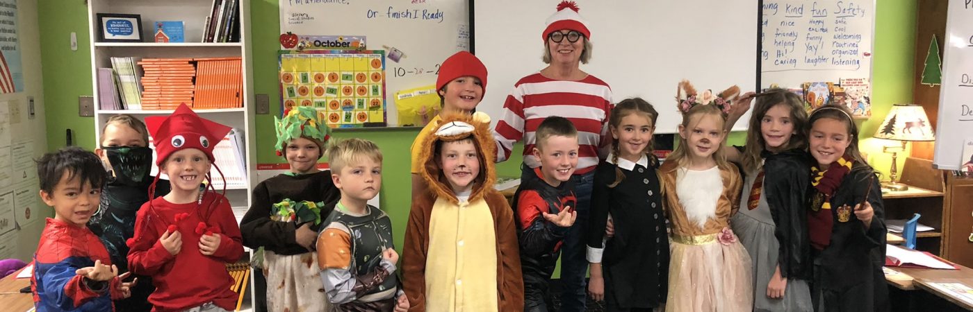 teacher and students dressed in customs 