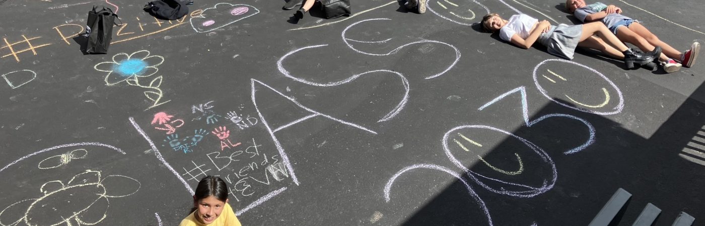 kids drawing with crayons on the school floor 