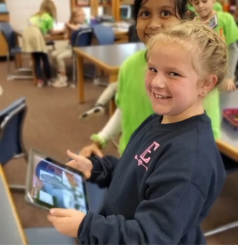 Student holding an ipad