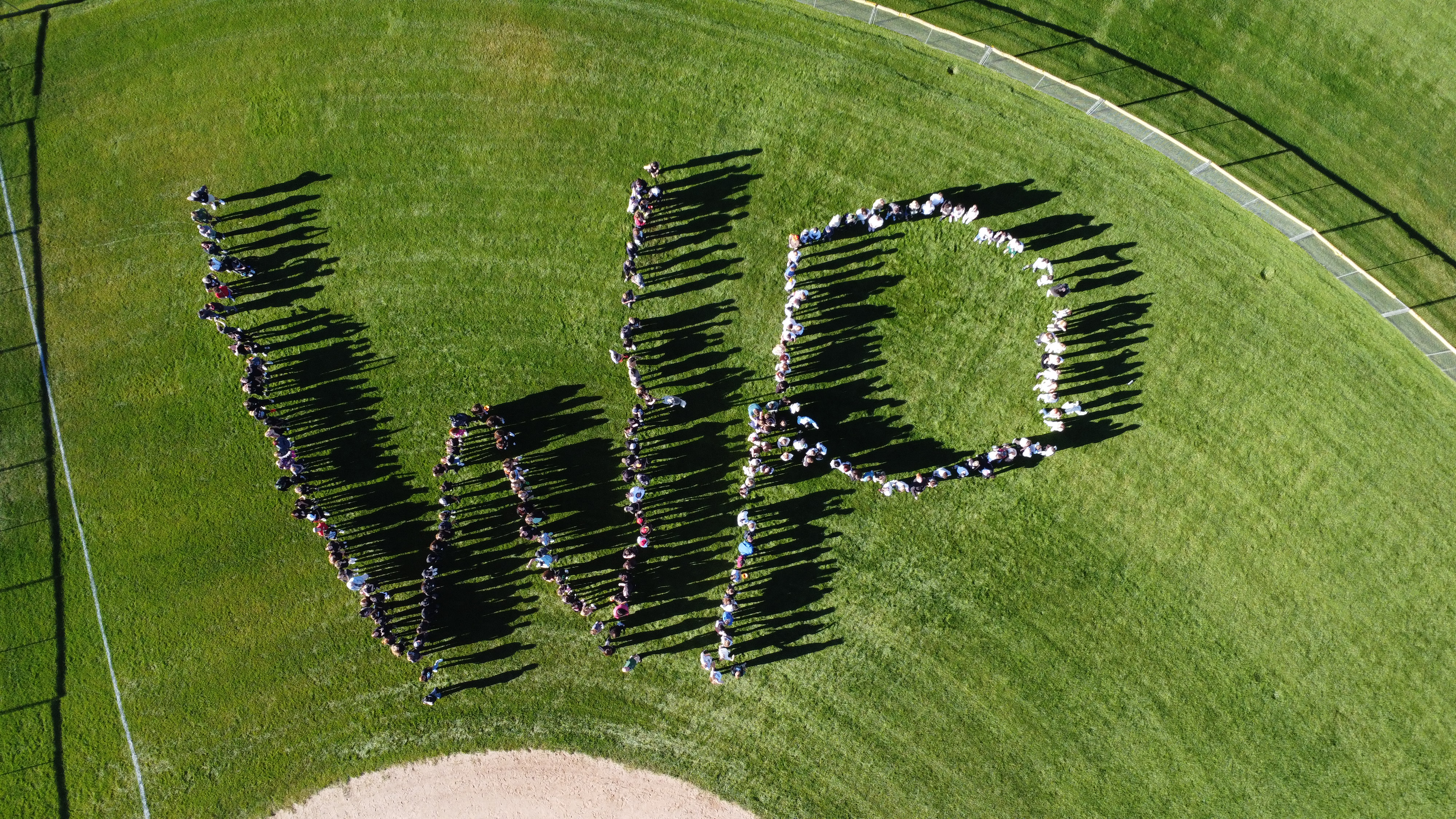 aerial view of students creating "wp"