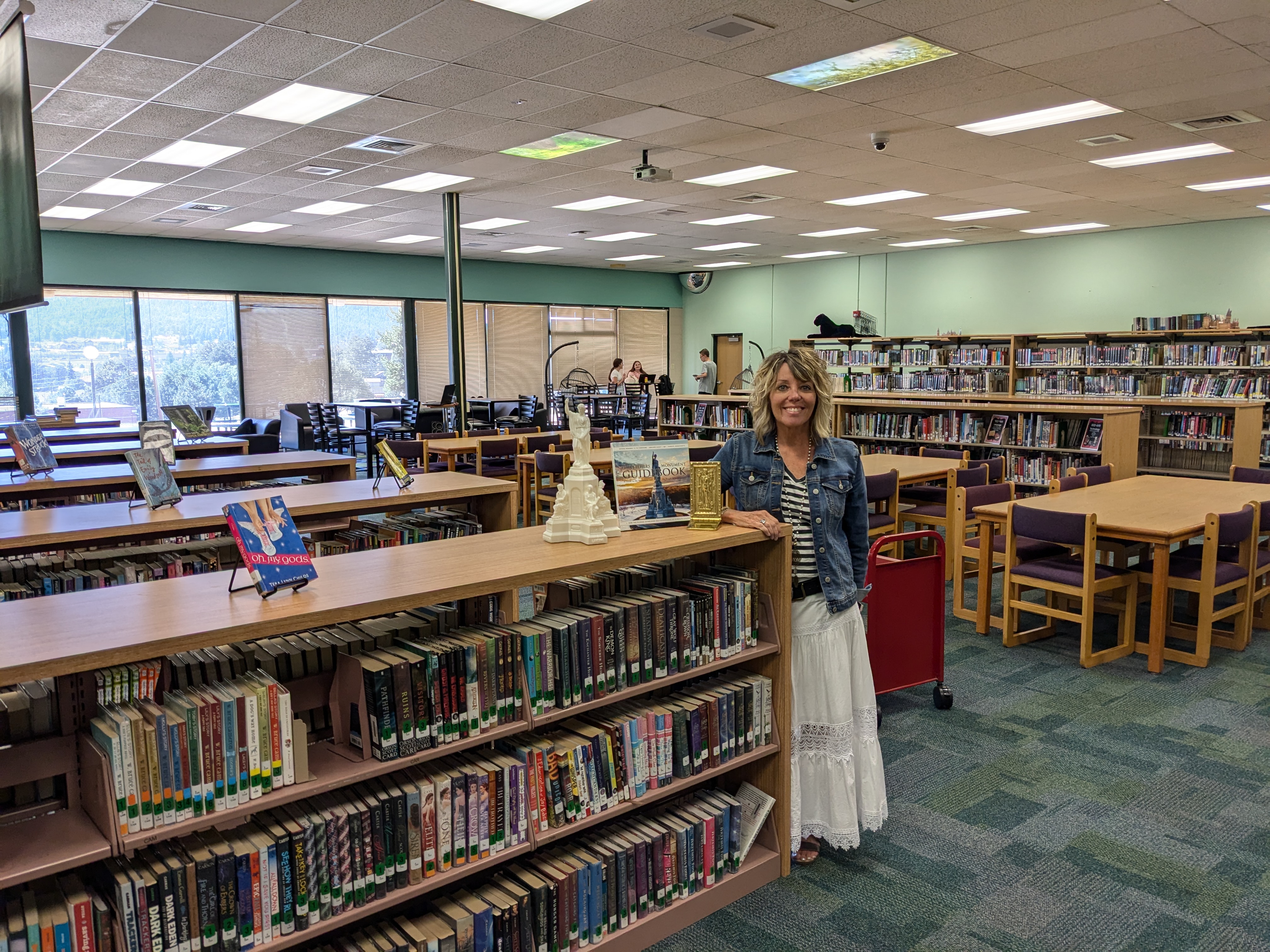 Ms. Padgett smiling in the library