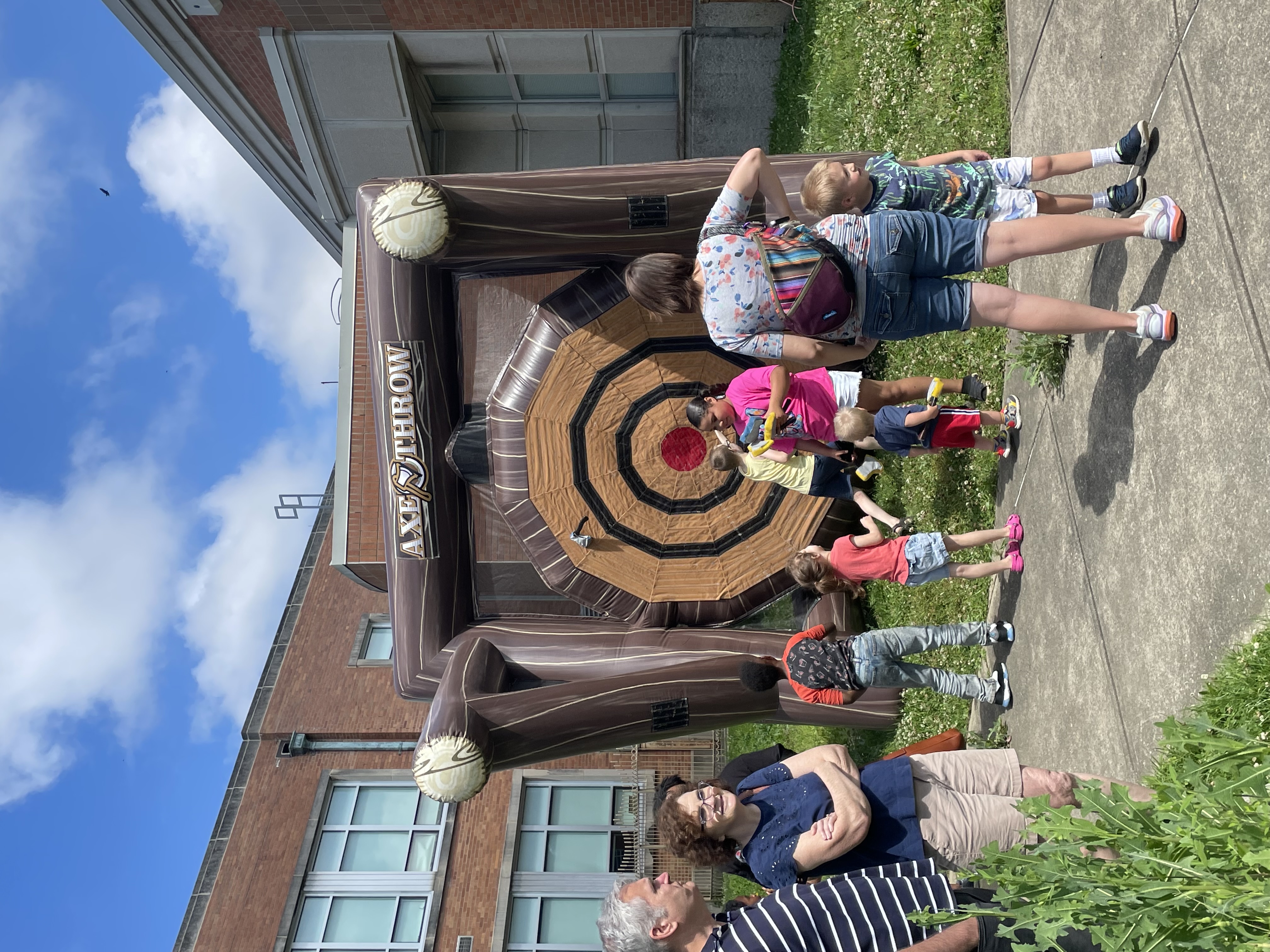 , students throwing at aInflatable dart board