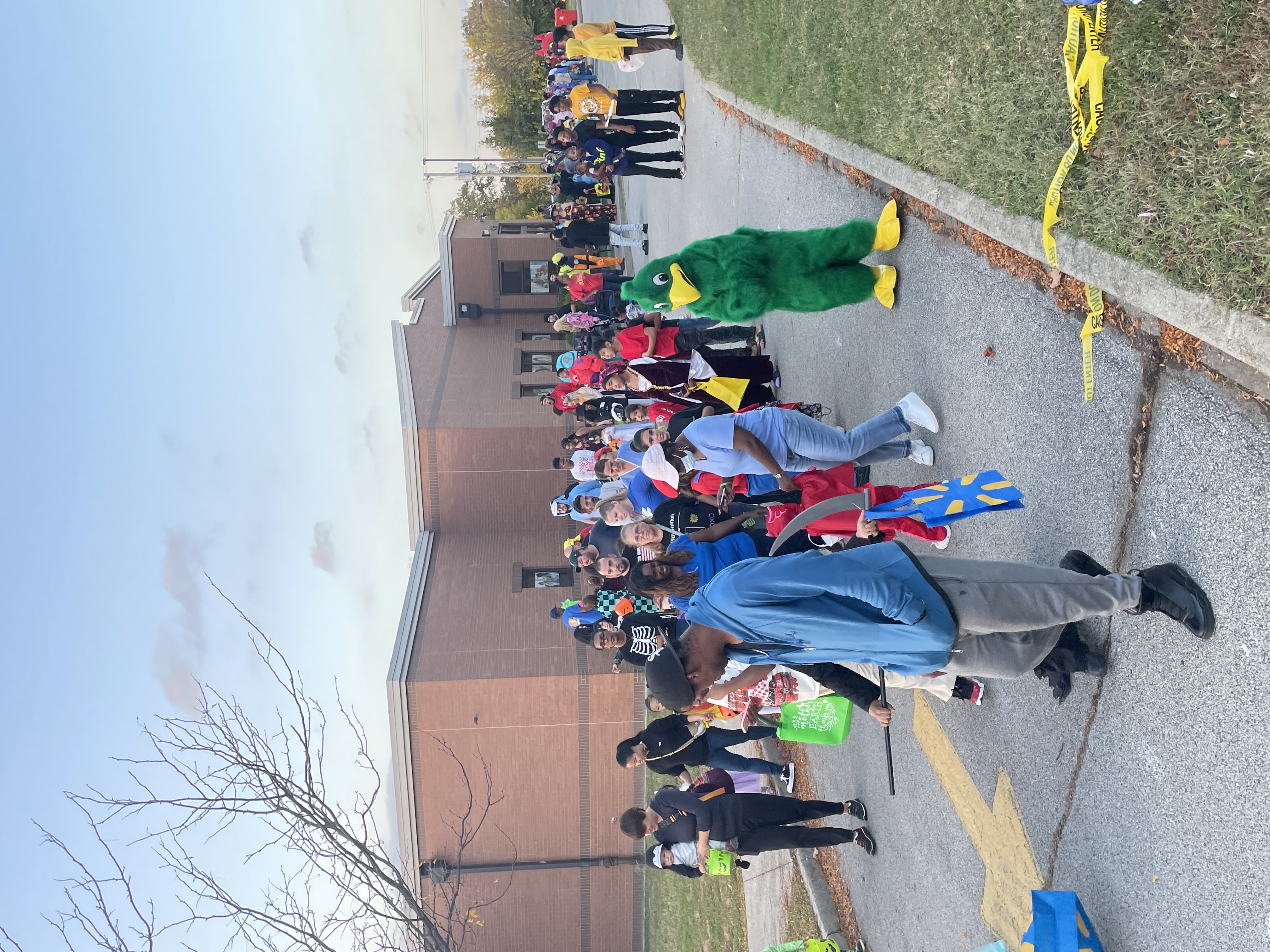 students dressed in costumes at trunk or treating event