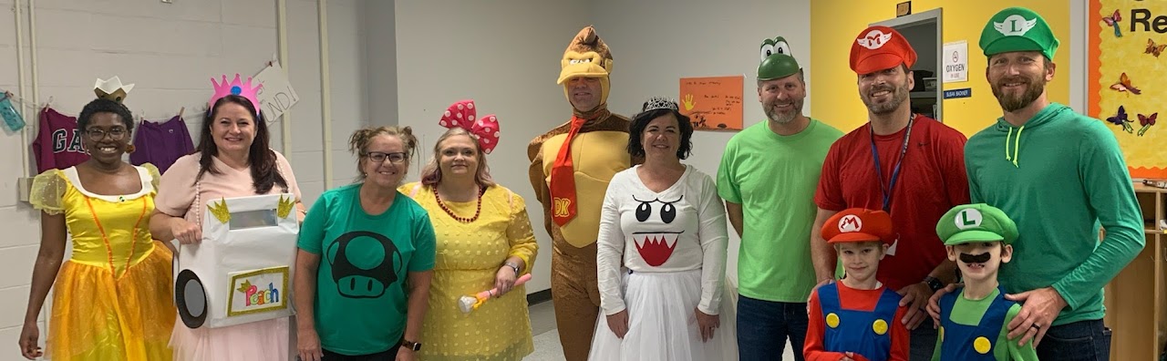 school staff dressed with costumes