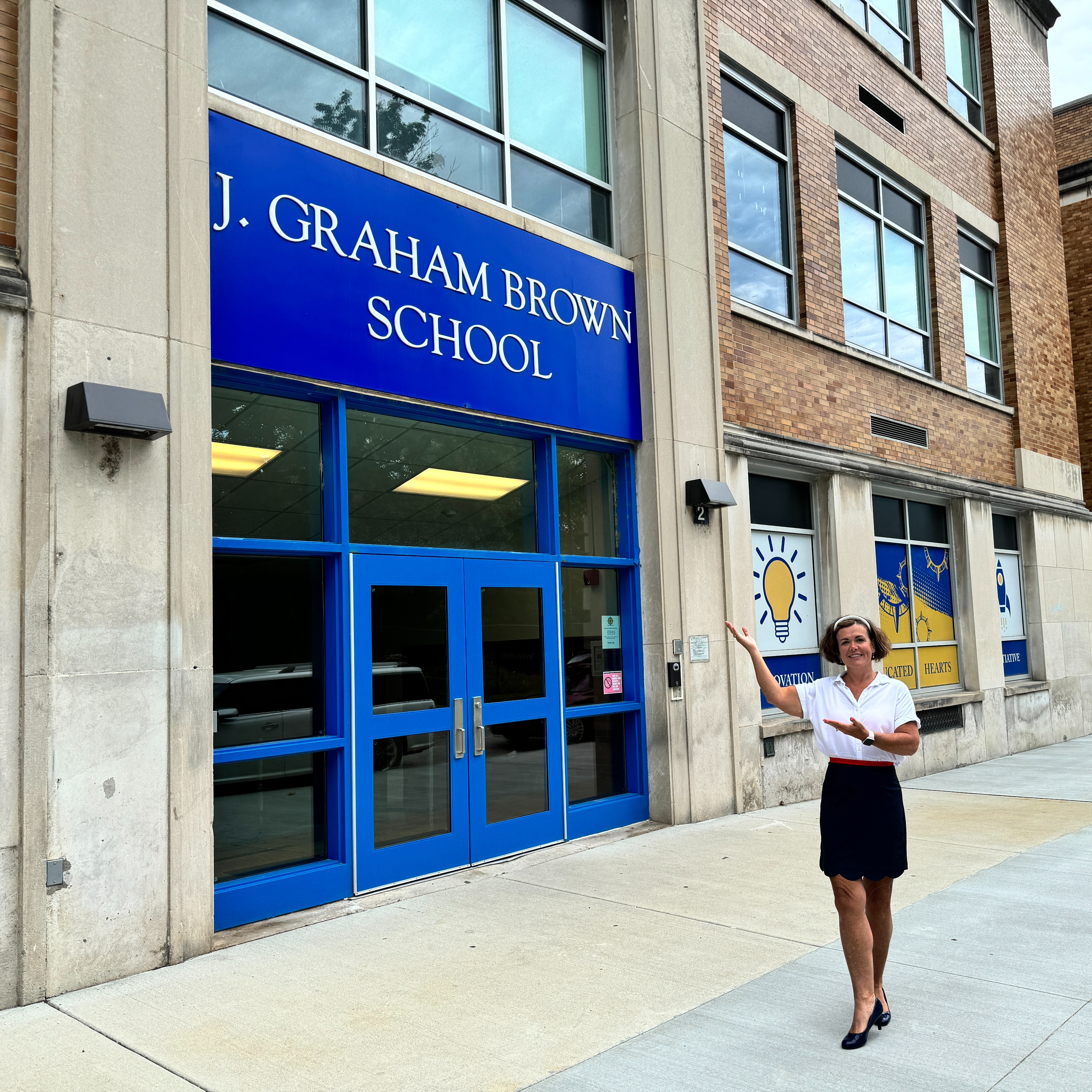 Dr. Angela in front of Brown School