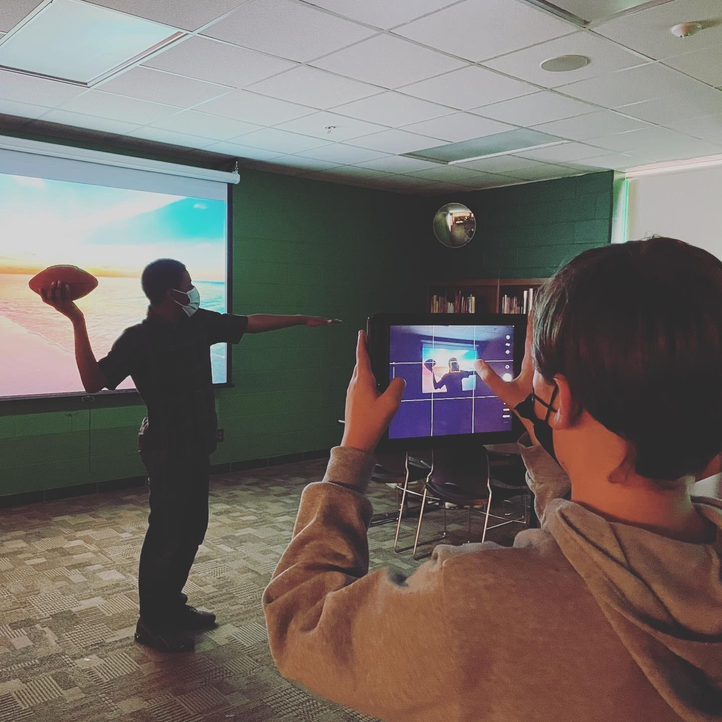 Student throwing a football