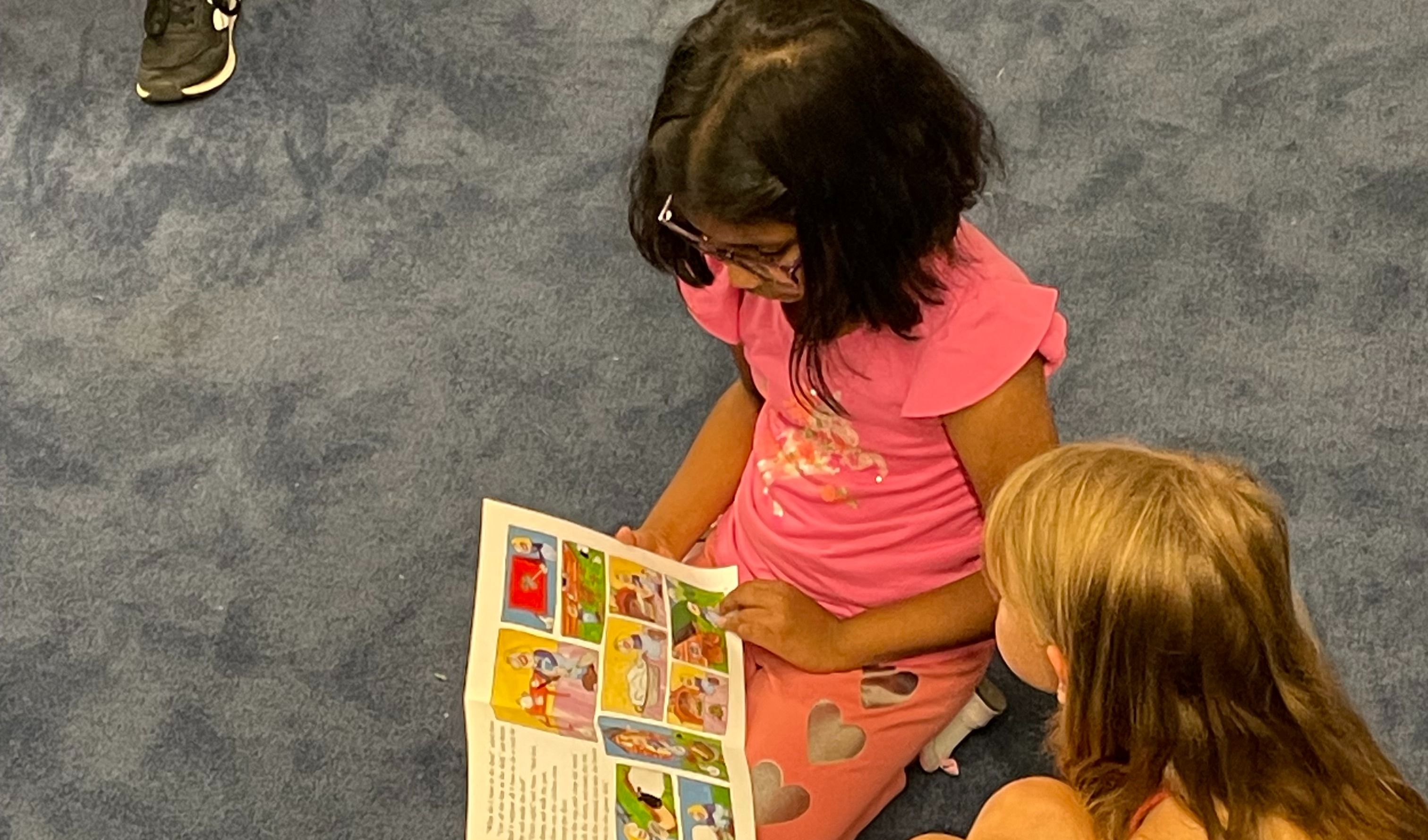 3rd grade buddy classes reading to their 1st grade buddies.