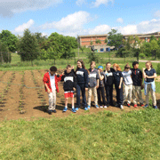 students posing for a picture on a field