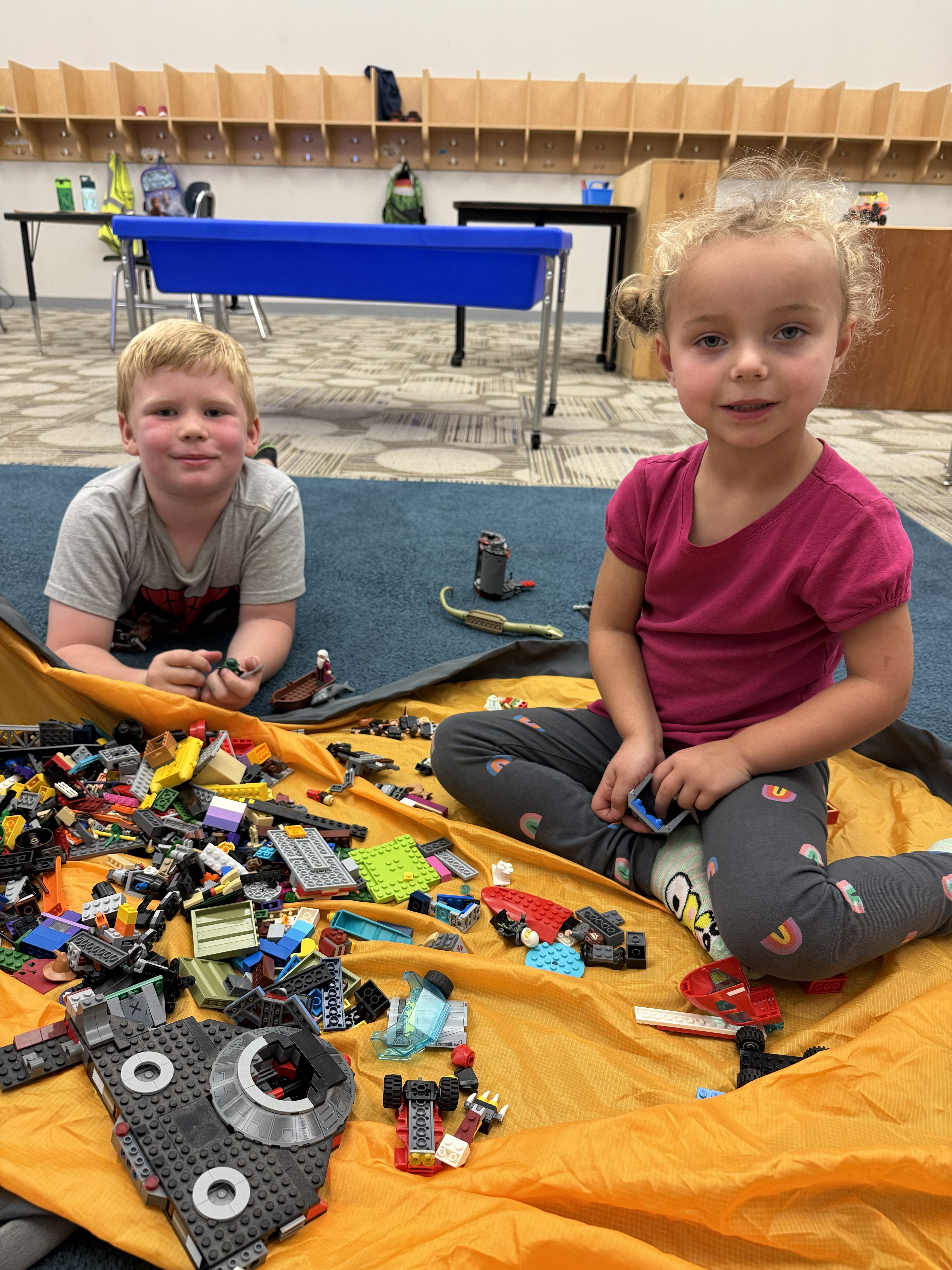 Two Hornet Care students playing with LEGO.