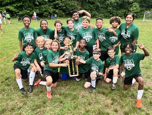 soccer team holding thropy