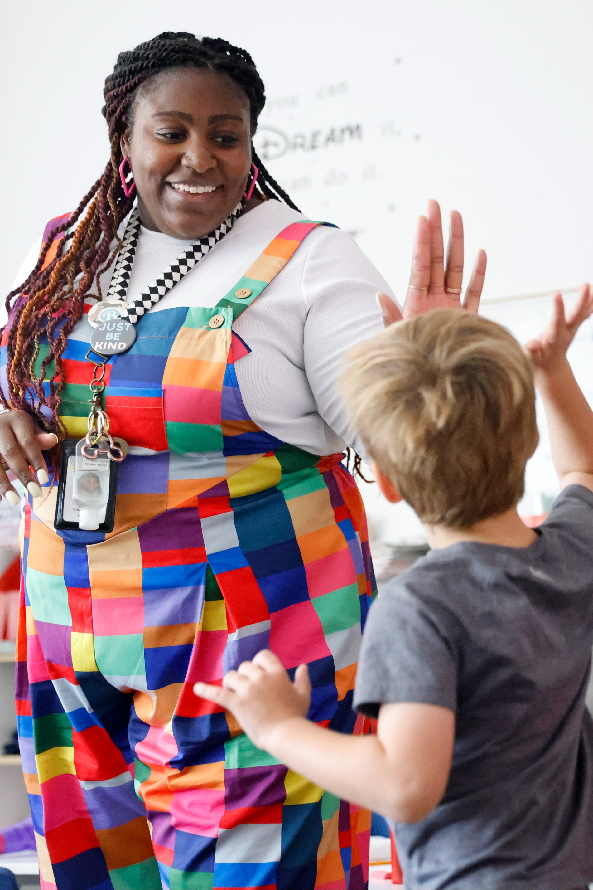 Teacher and student high-five