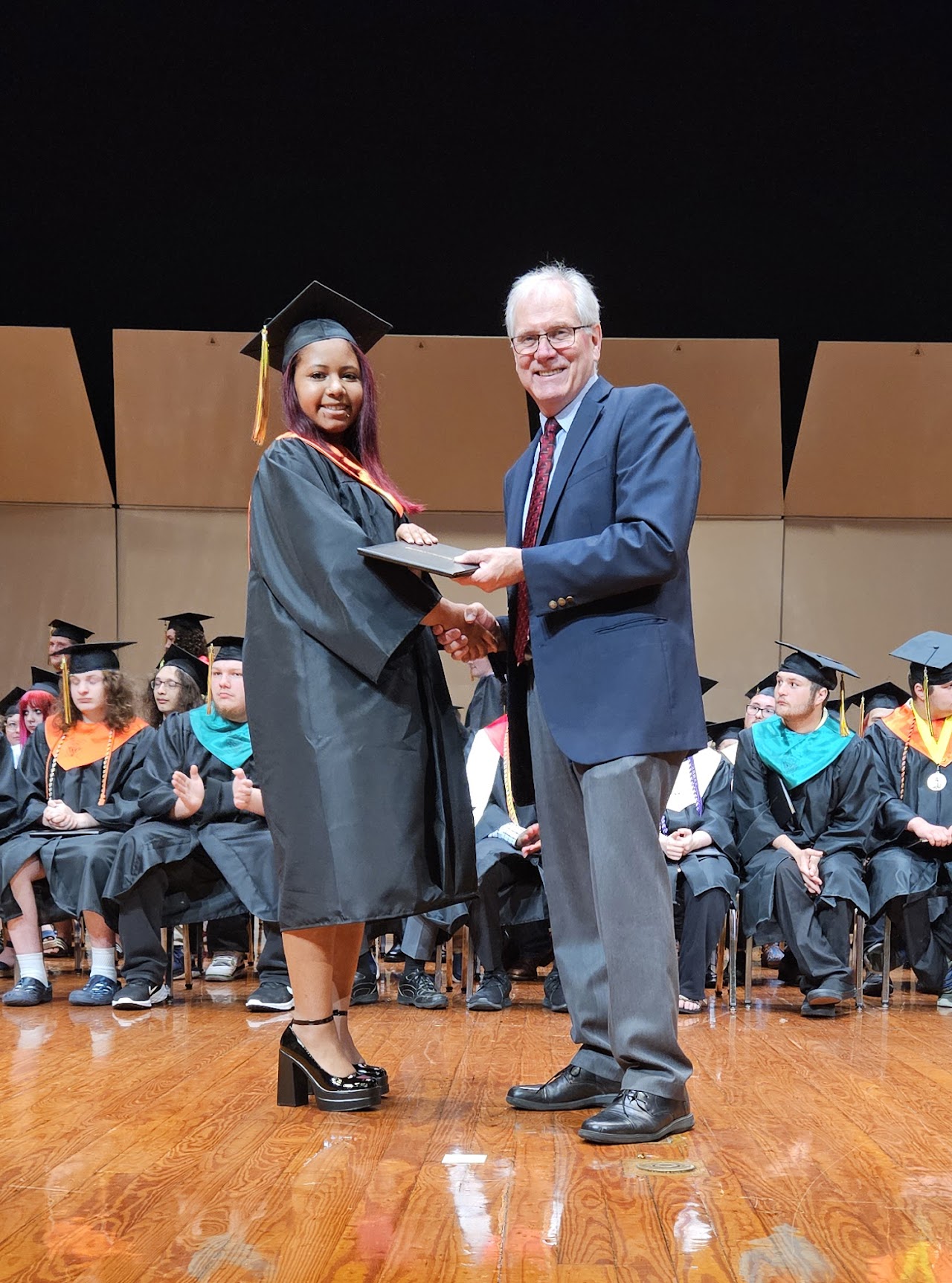 Student receiving diplomaStudent receiving diploma