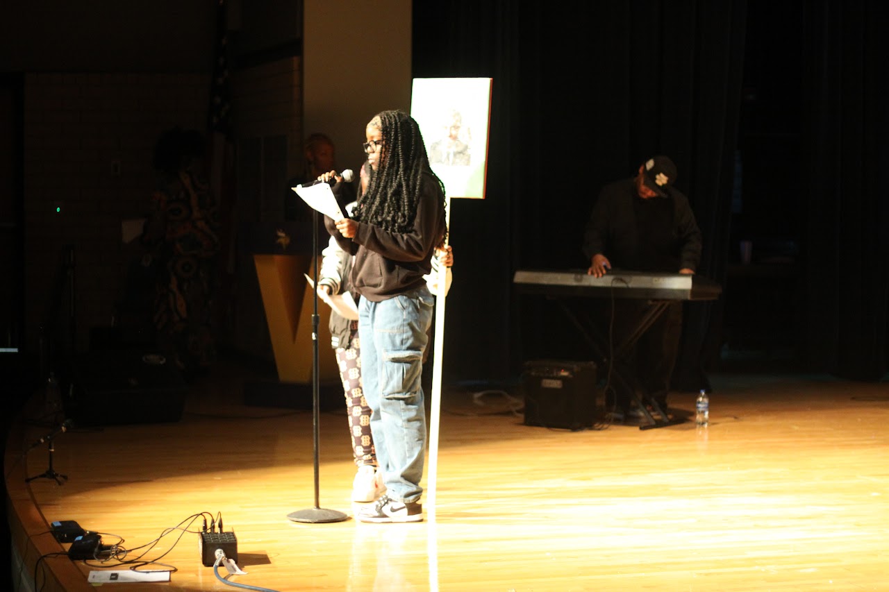 student with a microphone and presenting