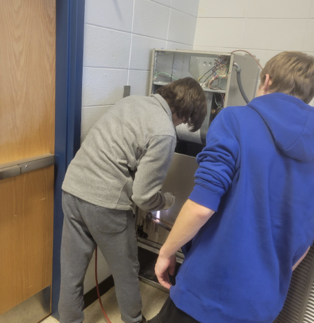 students checking out a machine