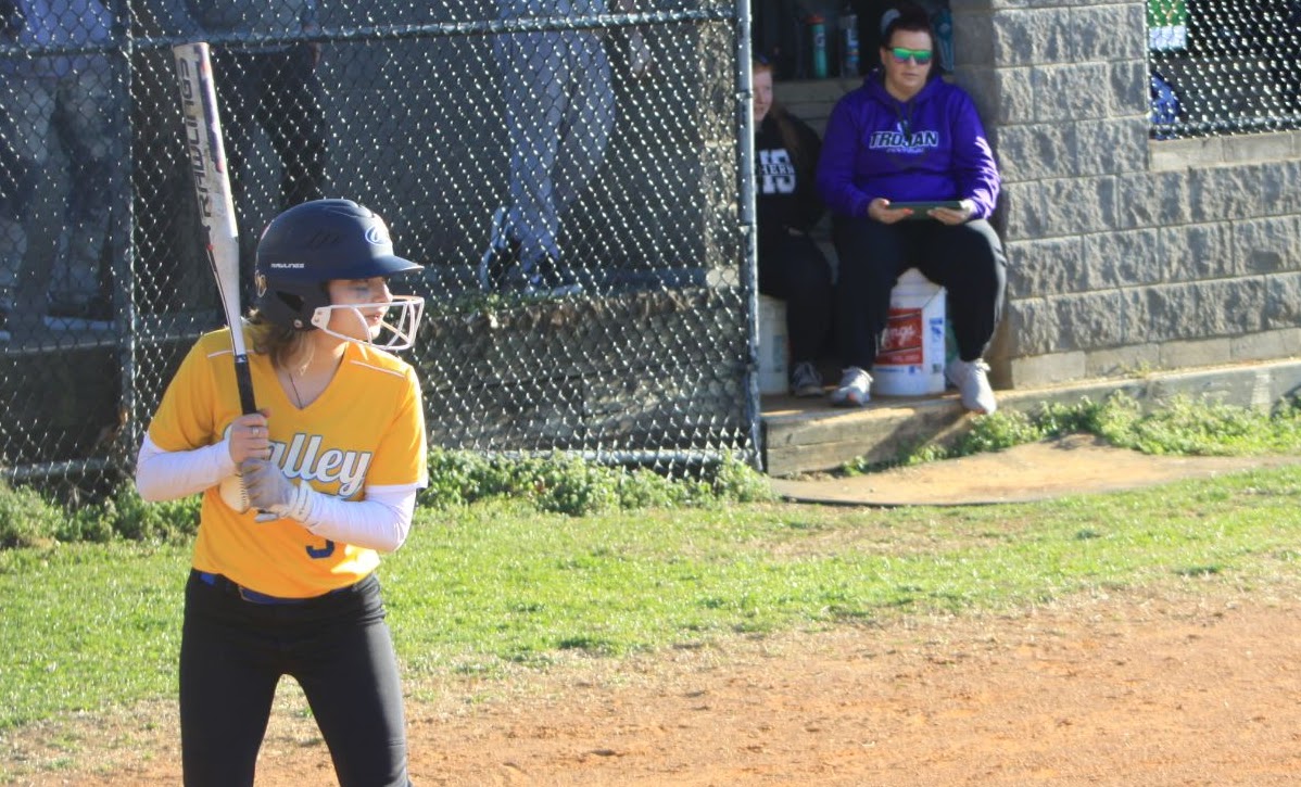 student in home plate waiting for the ball