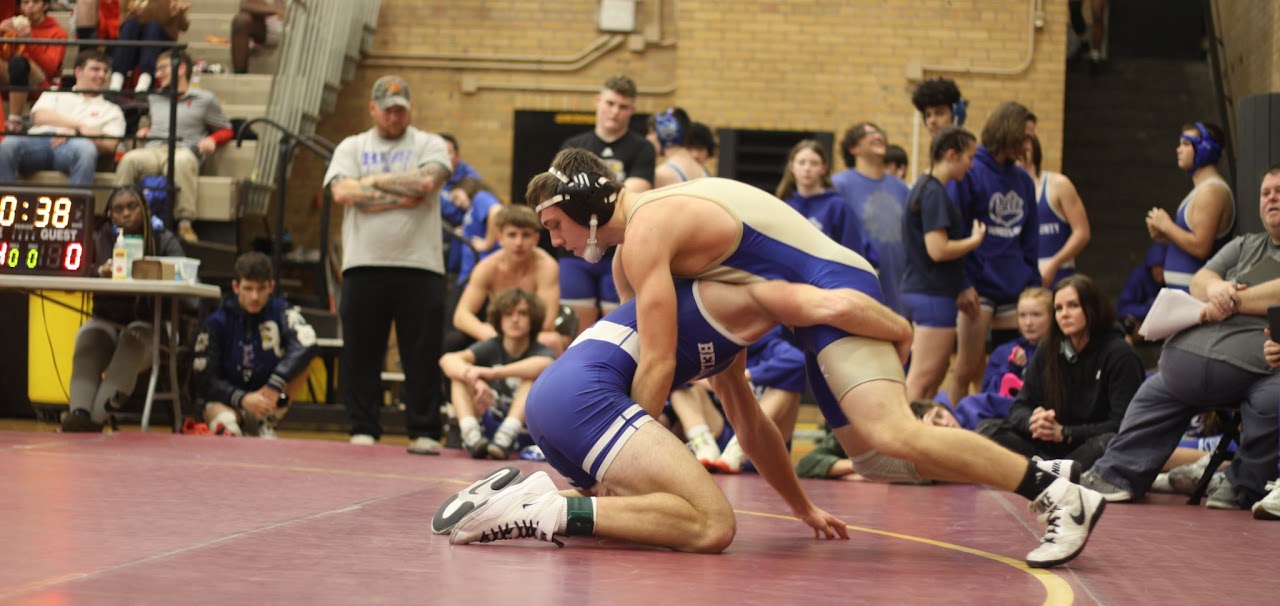 two students performing wrestling