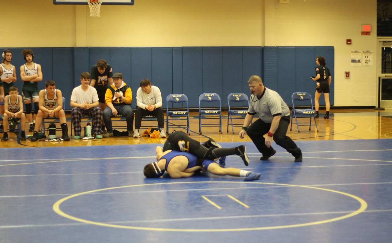 two students performing wrestling