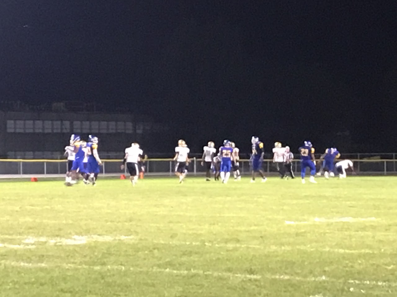 football team playing at night