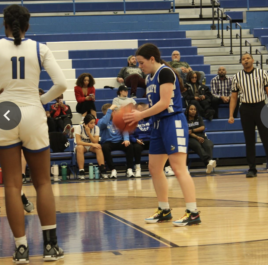 student holding the ball 