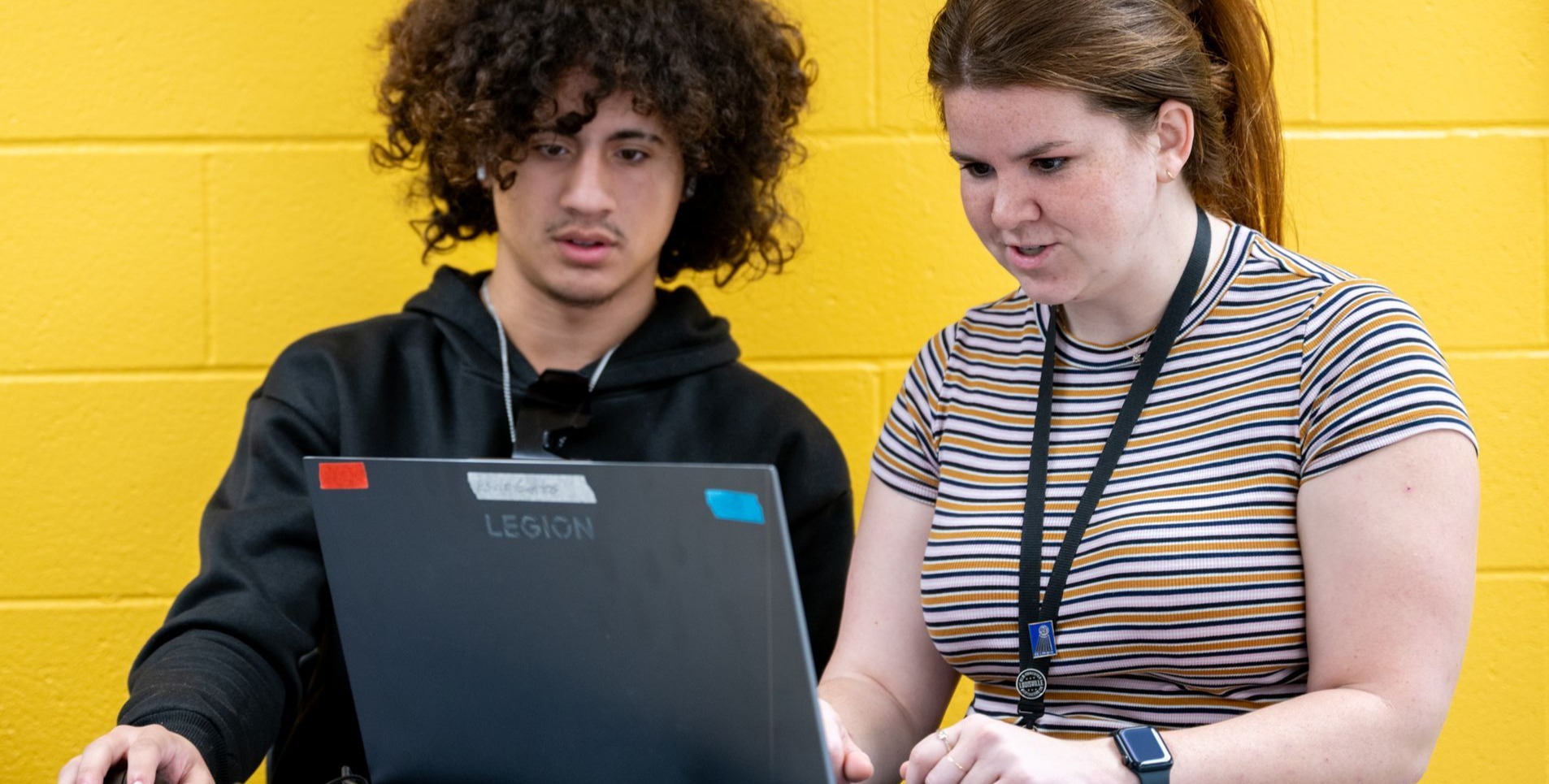 students working together on a laptop