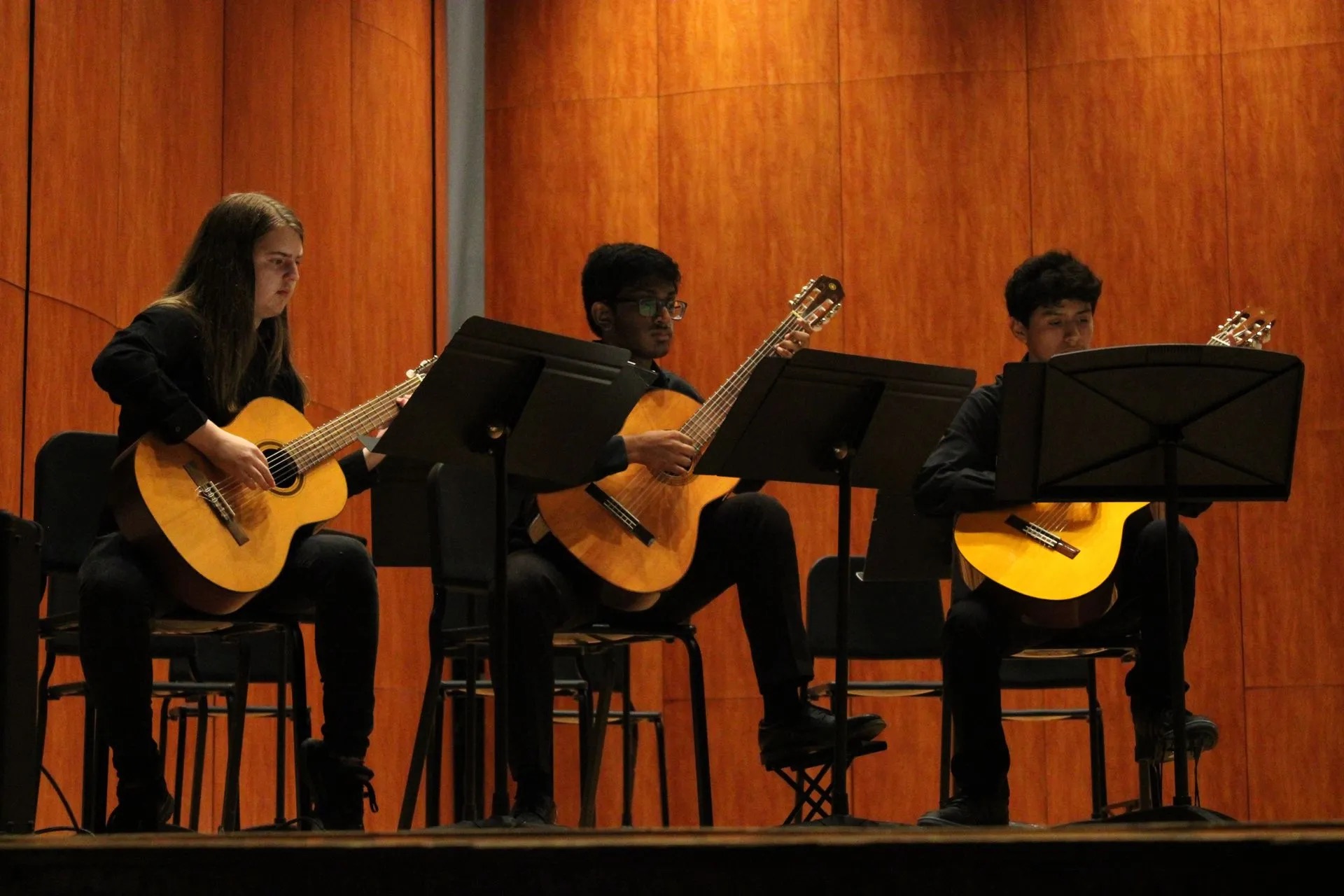 Students playing guitar