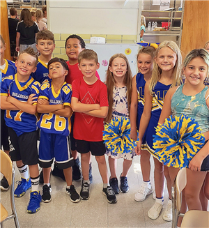 Kids cheer dance group, wearing their cheer dance uniform.