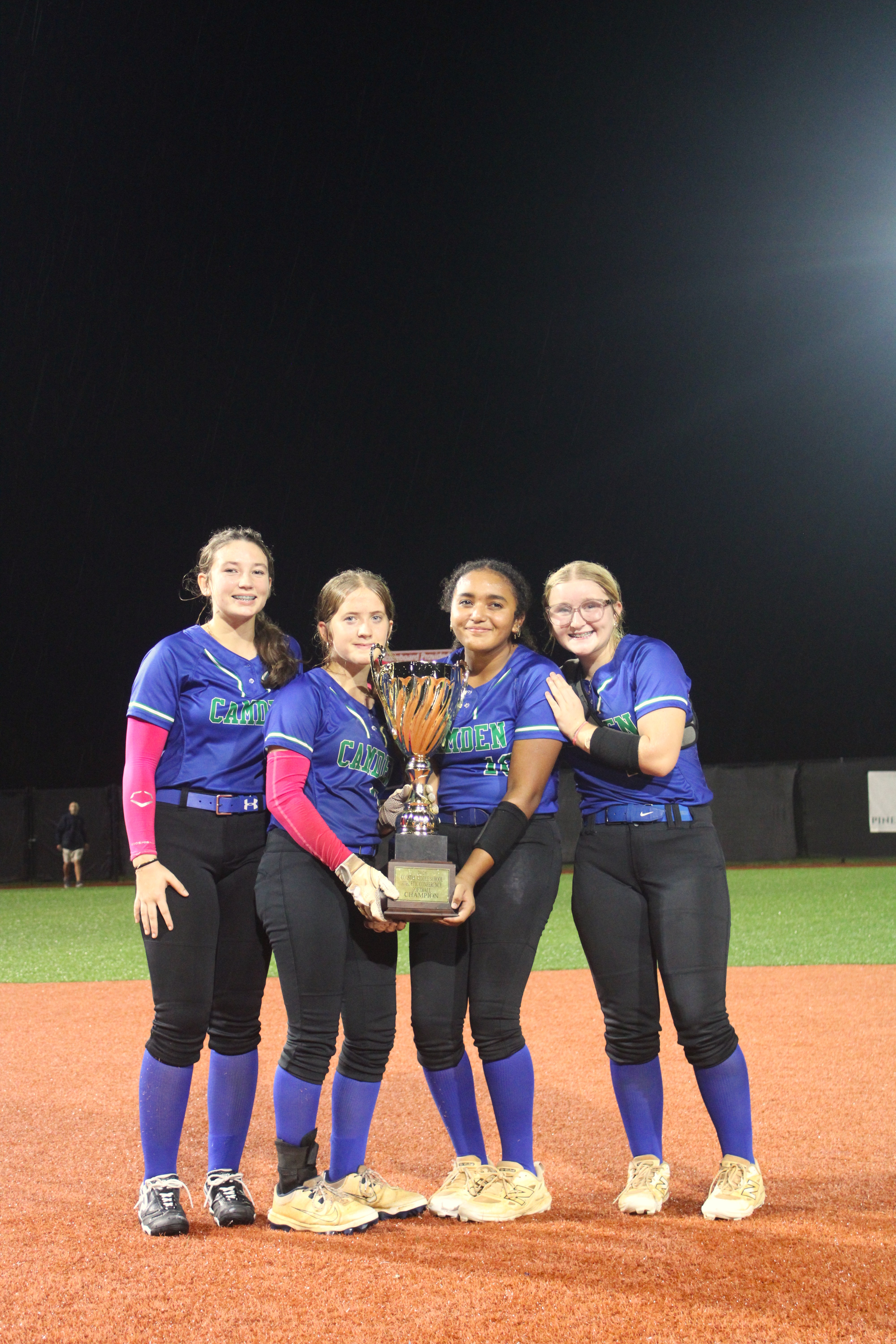 8th graders holding championship trophy