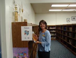 teacher holding a sign