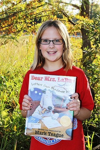 girl holding a book 