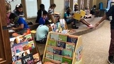 kids reading in a library