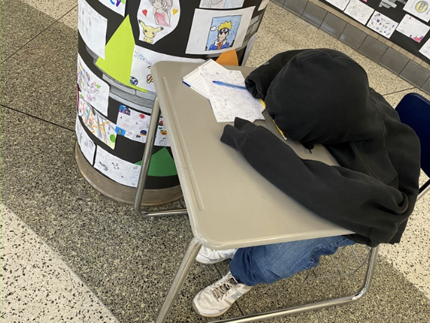 student reading at the classroom