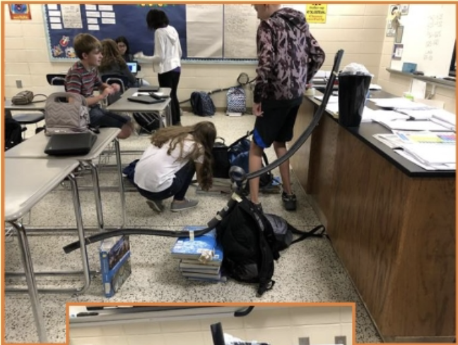 group of students in the middle of an activity in a classroom